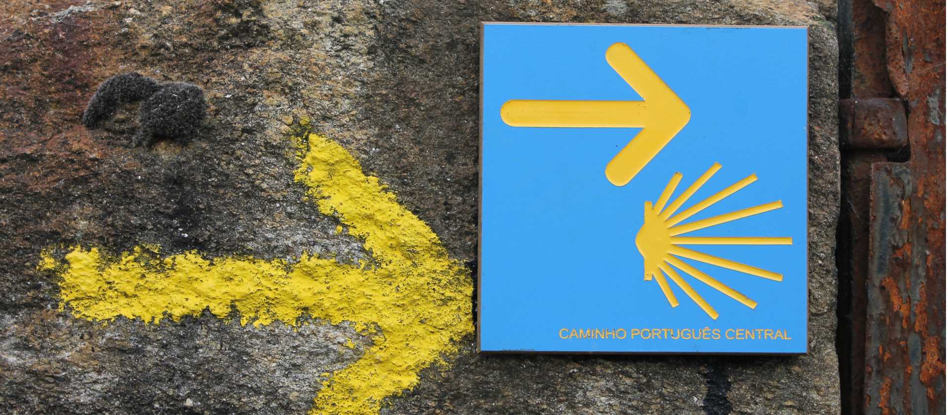 Portuguese Camino sign showing the way to Santiago de Compostela in Spain | Jaclyn Lofts