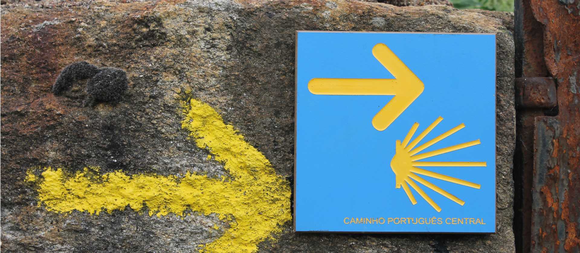 Portuguese Camino sign showing the way to Santiago de Compostela in Spain | Jaclyn Lofts