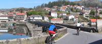 Cyclists entering a village on the Portuguese Camino