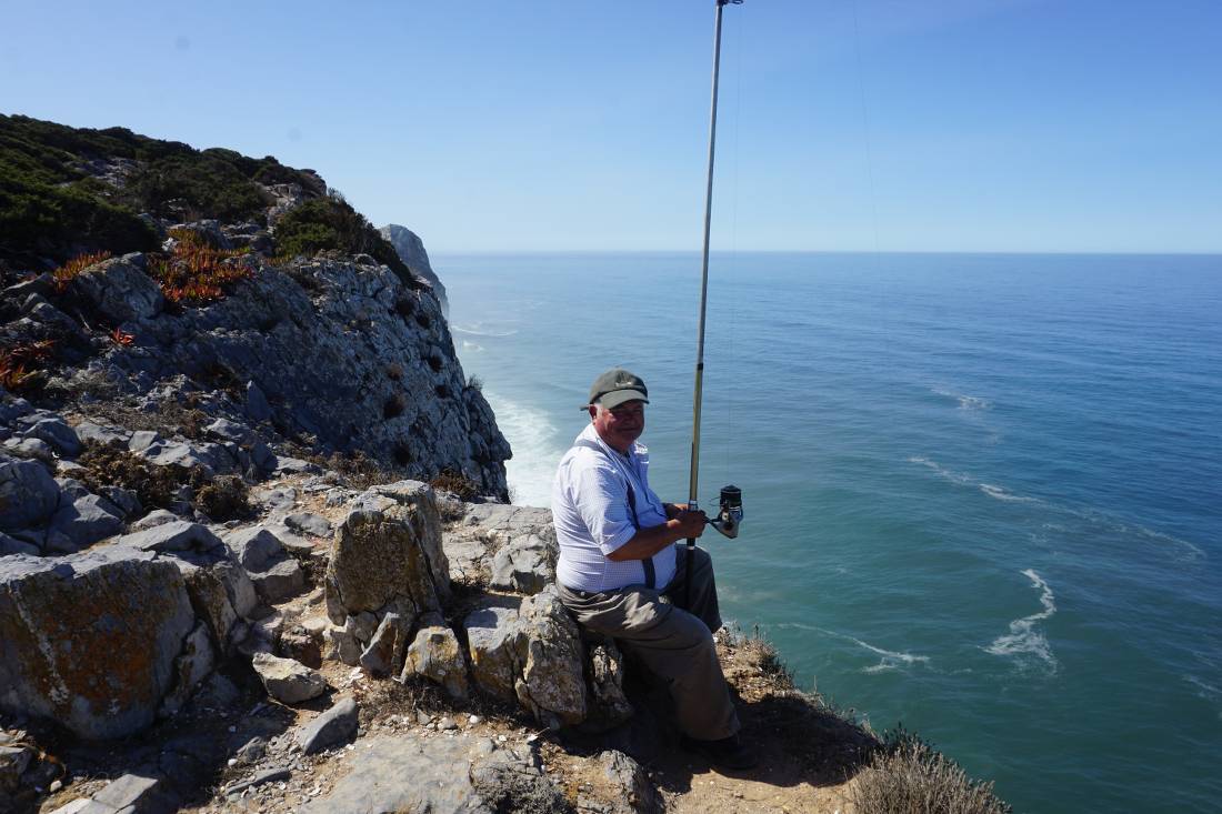 A fisherman on the coast near Cascais in Portugal
