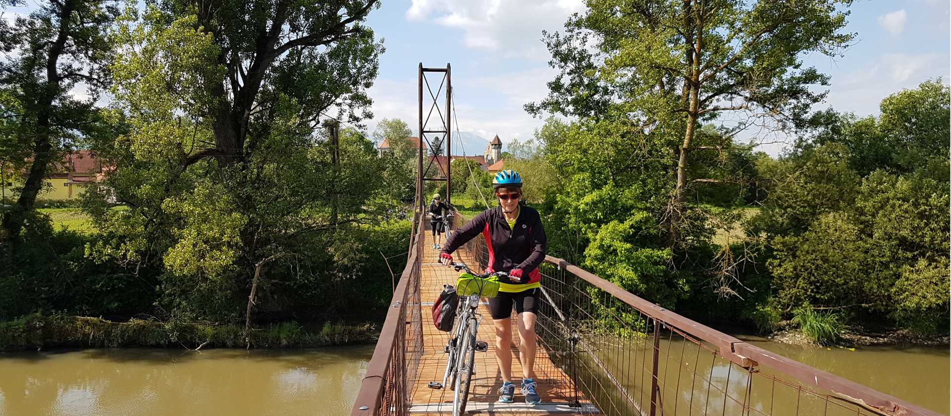 Crossing the Carta Village footbridge