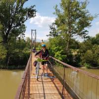 Crossing the Carta Village footbridge