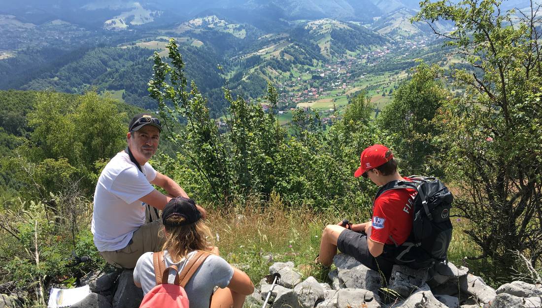 hiking group in the Bucegi Mountains foothills enroute to Bran |  <i>Kate Baker</i>