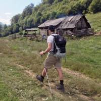 walking past simple farmhouses in Transylvania | Kate Baker