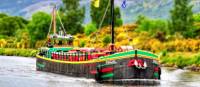 The comfortable floating hotel barge, Fingal, approaching Inverness