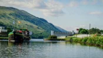 The Ros Crana barge leaving Loch Oich