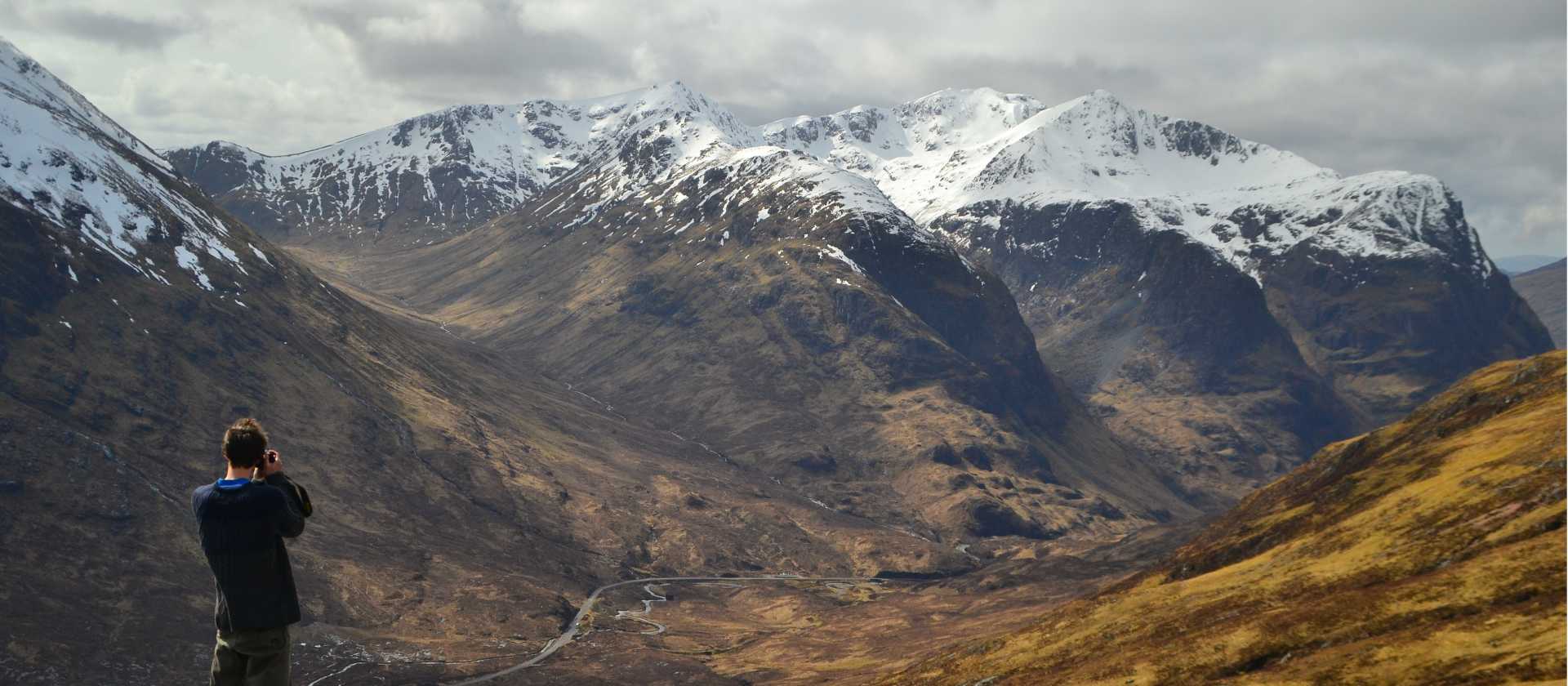 Views of snow-capped mountains along the West Highland Way