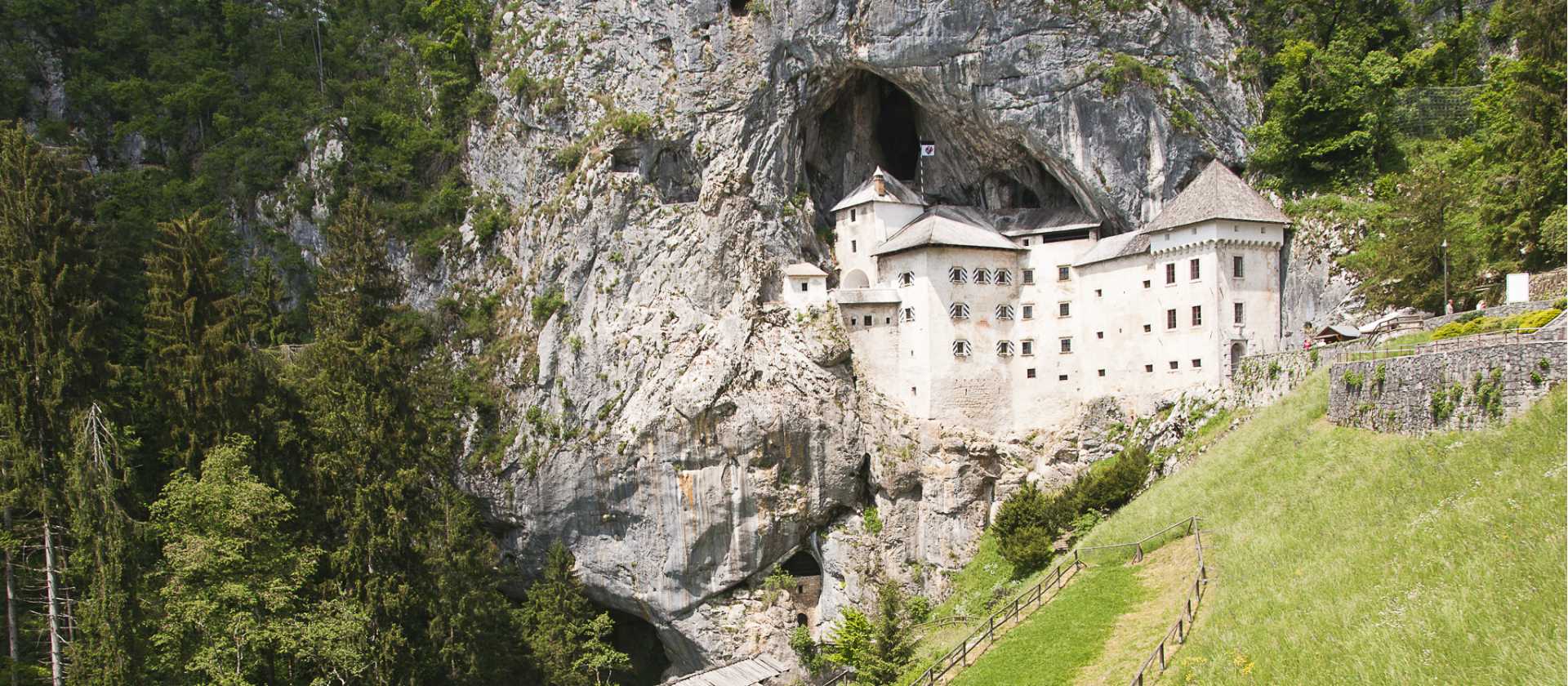 Predjama Castle, dramatically built into a 123m/404ft-high limestone cliff near Postojna – an optional detour on the ride to Postojna.