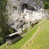 Predjama Castle, dramatically built into a 123m/404ft-high limestone cliff near Postojna – an optional detour on the ride to Postojna.