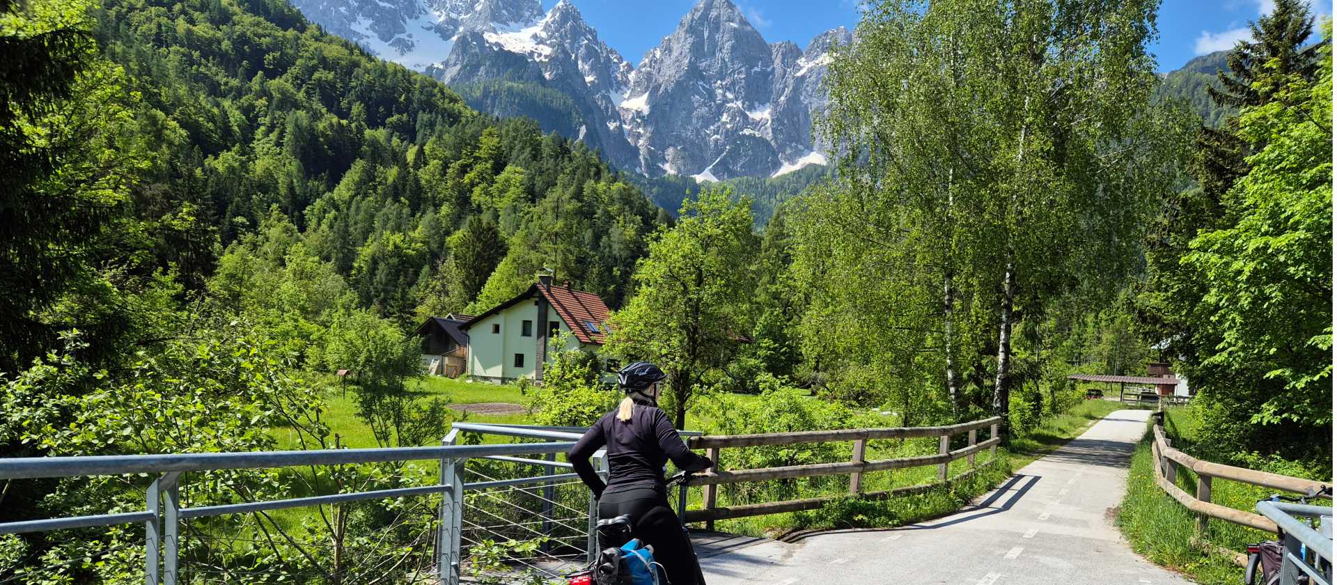 Cyclist taking in the views of the Julian Alps