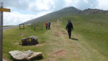 Pilgrim crossing a pass on the Camino de Santiago trail to Roncesvalles