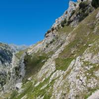 Hiking in the rugged terrain of the Picos de Europa in Spain | Dkatana