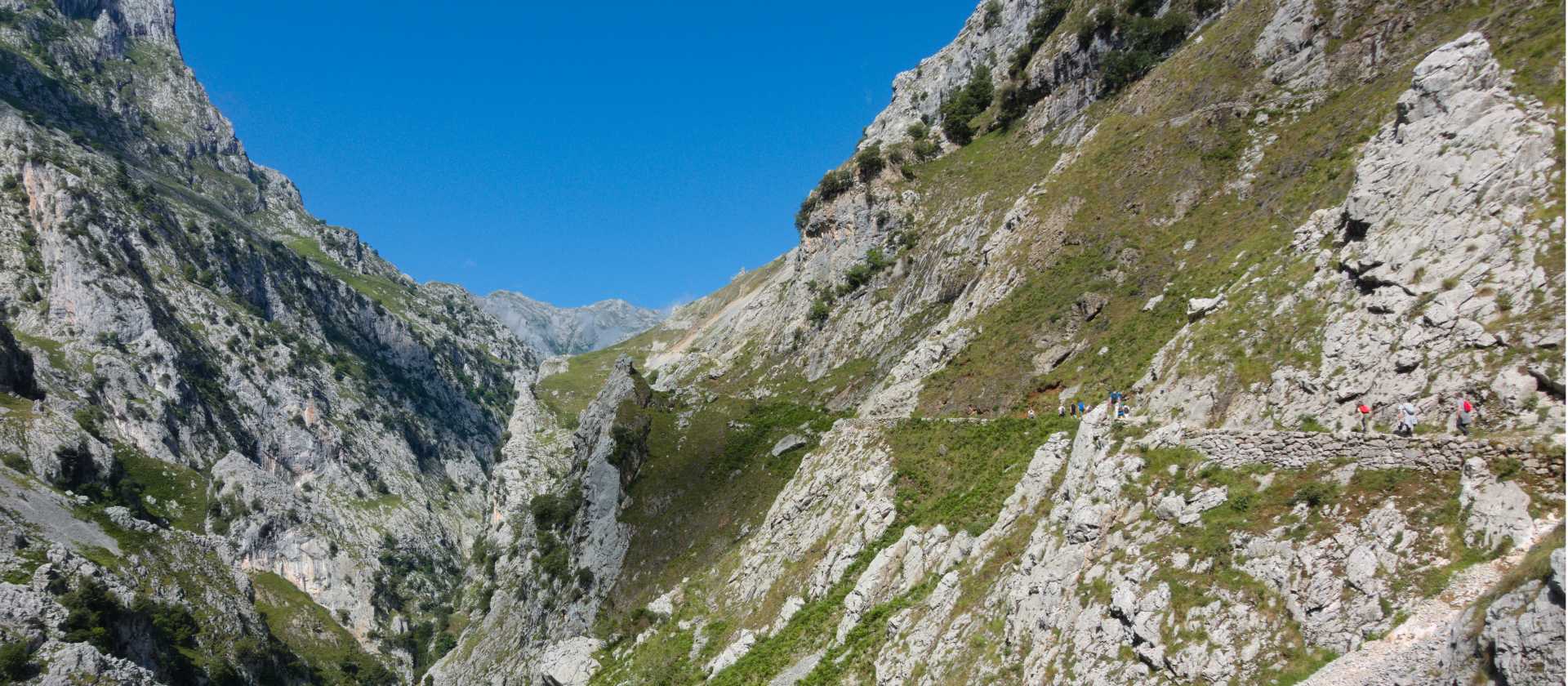 Hiking in the rugged terrain of the Picos de Europa in Spain | Dkatana