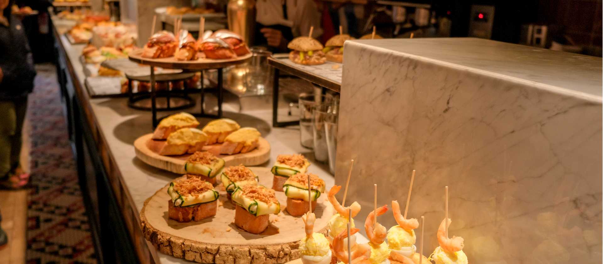 Try traditional pintxos (or tapas) at a bar in San Sebastian, Basque country, in Spain.