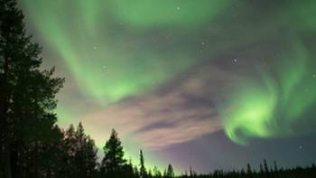 Swirling northern lights in Swedish Lapland