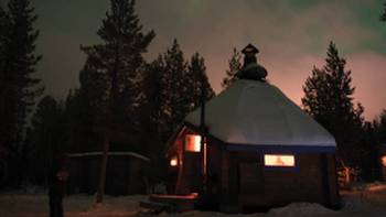 cabin with northern lights in background,Ross Baker cabin with northern lights in background