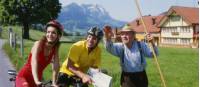 Cyclists getting directions from a local farmer in Switzerland