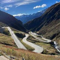 Cyclists descending the dramatic switchbacks from the Gotthard Pass