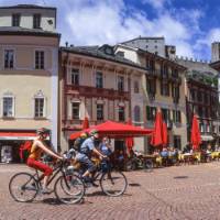 Cycle through quaint old villages on your way to one of the lakes in the Ticino region of Switzerland