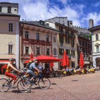 Cycle through quaint old villages on your way to one of the lakes in the Ticino region of Switzerland