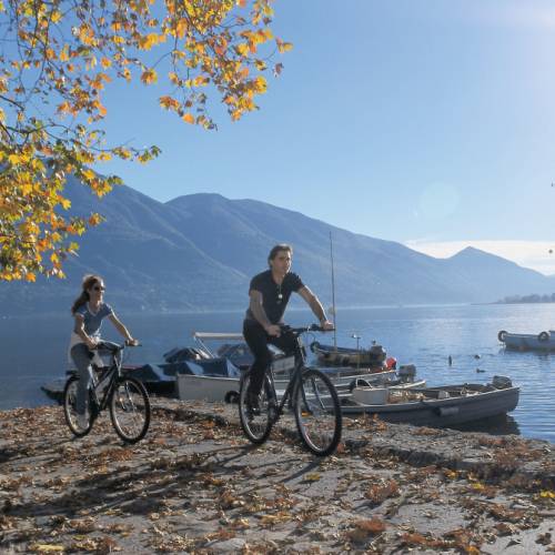 Cycling alone one of the many beautiful lakes in Ticino