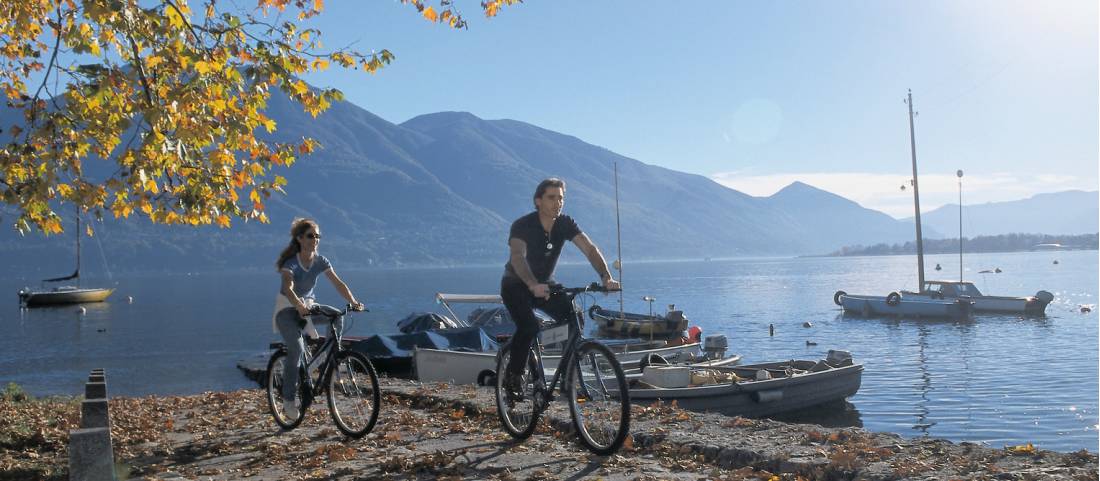 Cycling alone one of the many beautiful lakes in Ticino