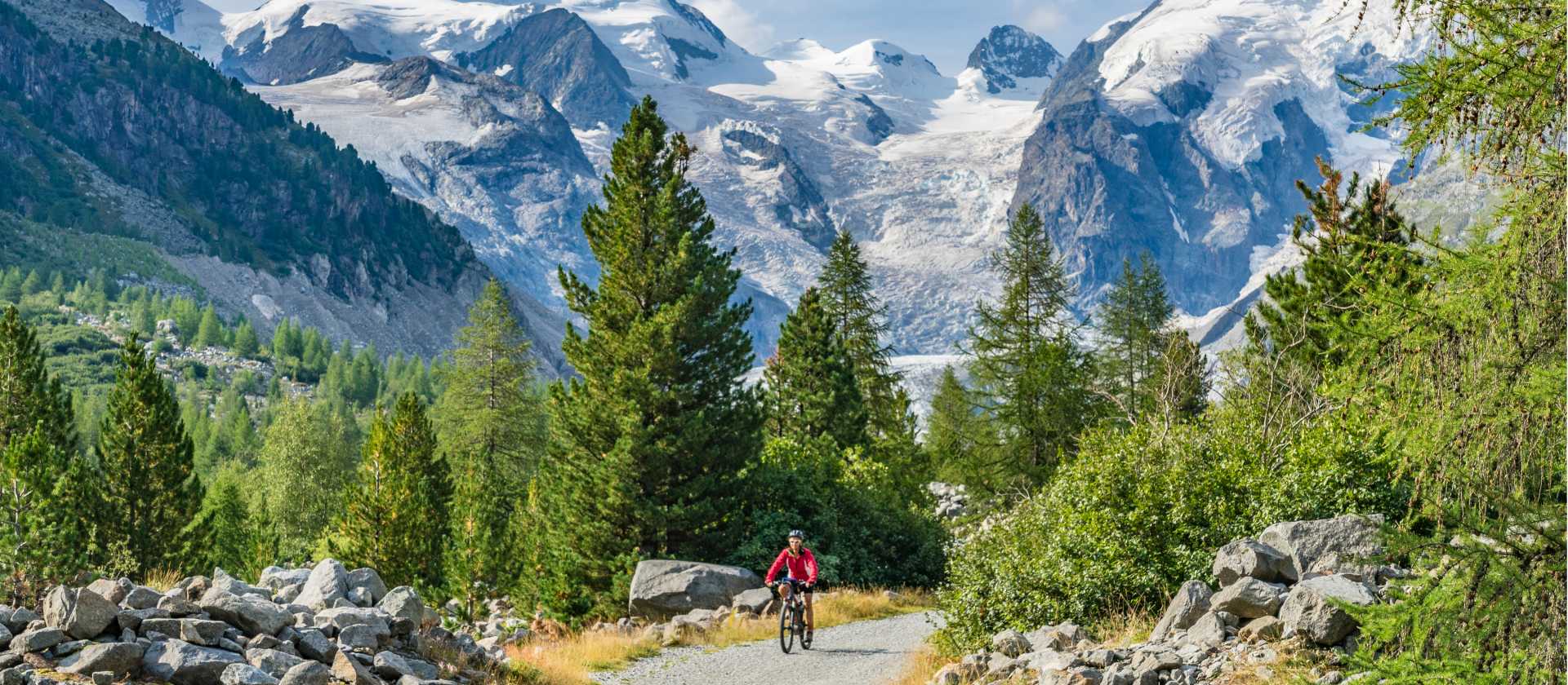 Cycling against a backdrop of Swiss mountains