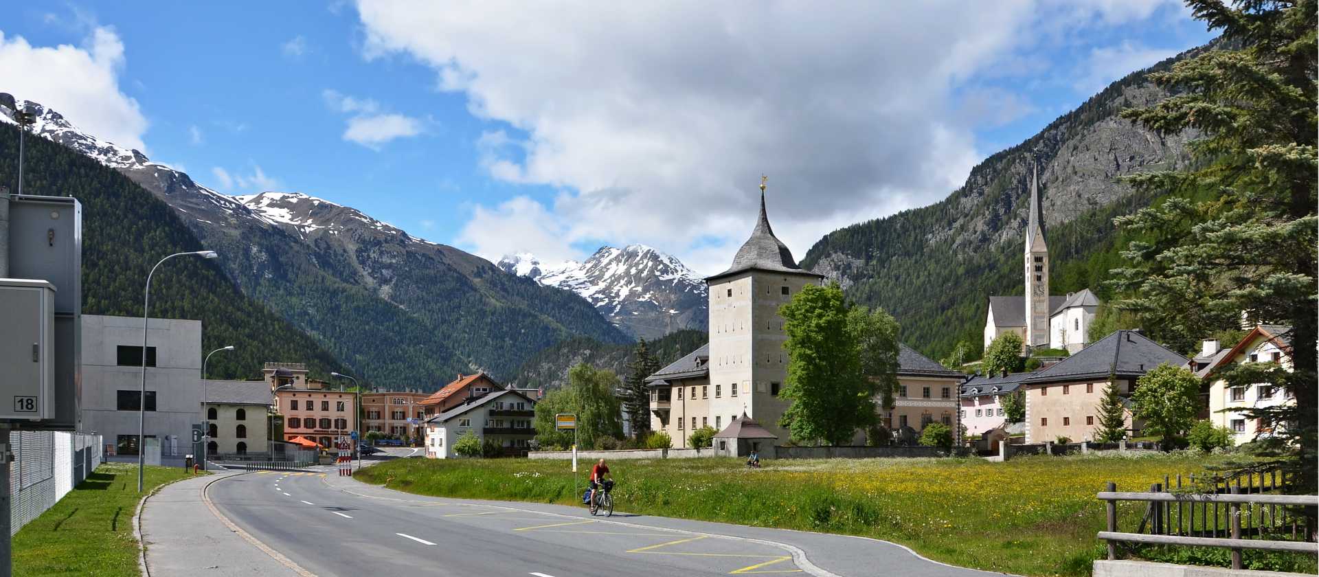 Cycling by Zernez Castle in Switzerland