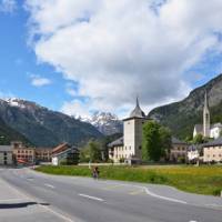 Cycling by Zernez Castle in Switzerland