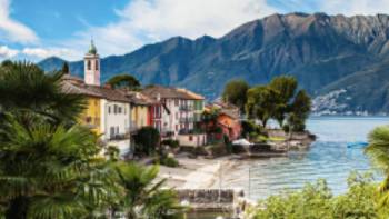 Colourful houses line Lake Maggiore in the Ticino Canton of Switzerland