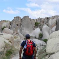 A walker in Cappadocia, walking through the rock formations | Erin Williams