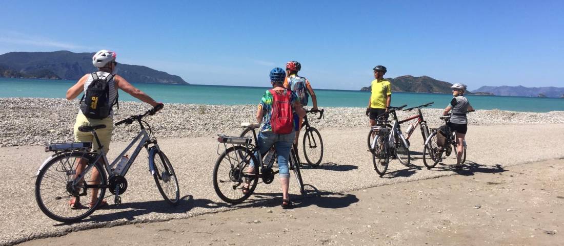 Pedalling along the empty stretches of Fethiye Beach in Turkey