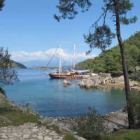 Boat moored at the ruins of 'Cleopatra's baths' on our Turkey Walk & Sail | Kate Baker