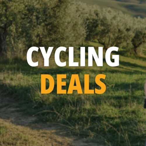 Cycling trail winds through sunlit olive groves and rolling green hills.