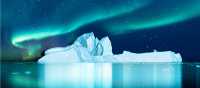 Aurora Borealis lights up the fjord in Greenland