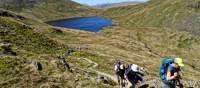 Hikers above Grizedale Tarn in the Lake District | John Millen