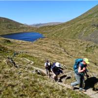 Hikers above Grizedale Tarn in the Lake District | John Millen