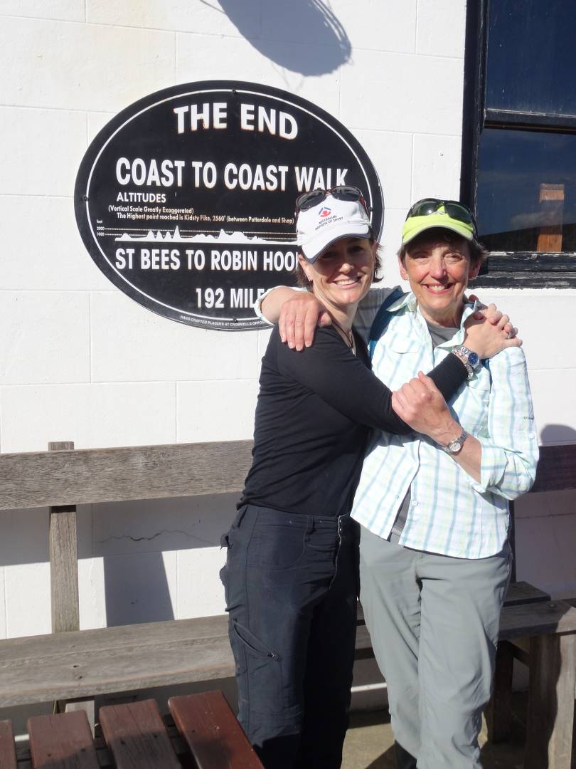 Happy hikers at the end of the Coast to Coast Trail in Robin Hood's Bay |  <i>John Millen</i>