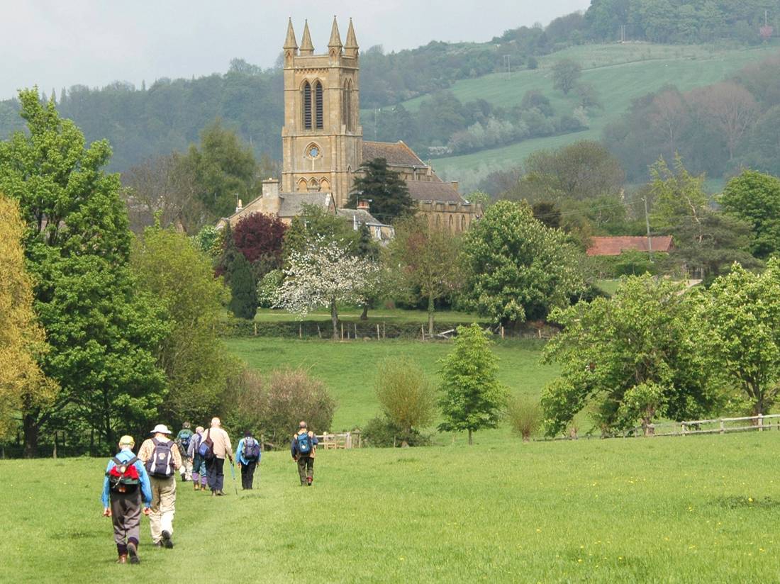 A group of walkers arrives in Broadway in the Cotswolds