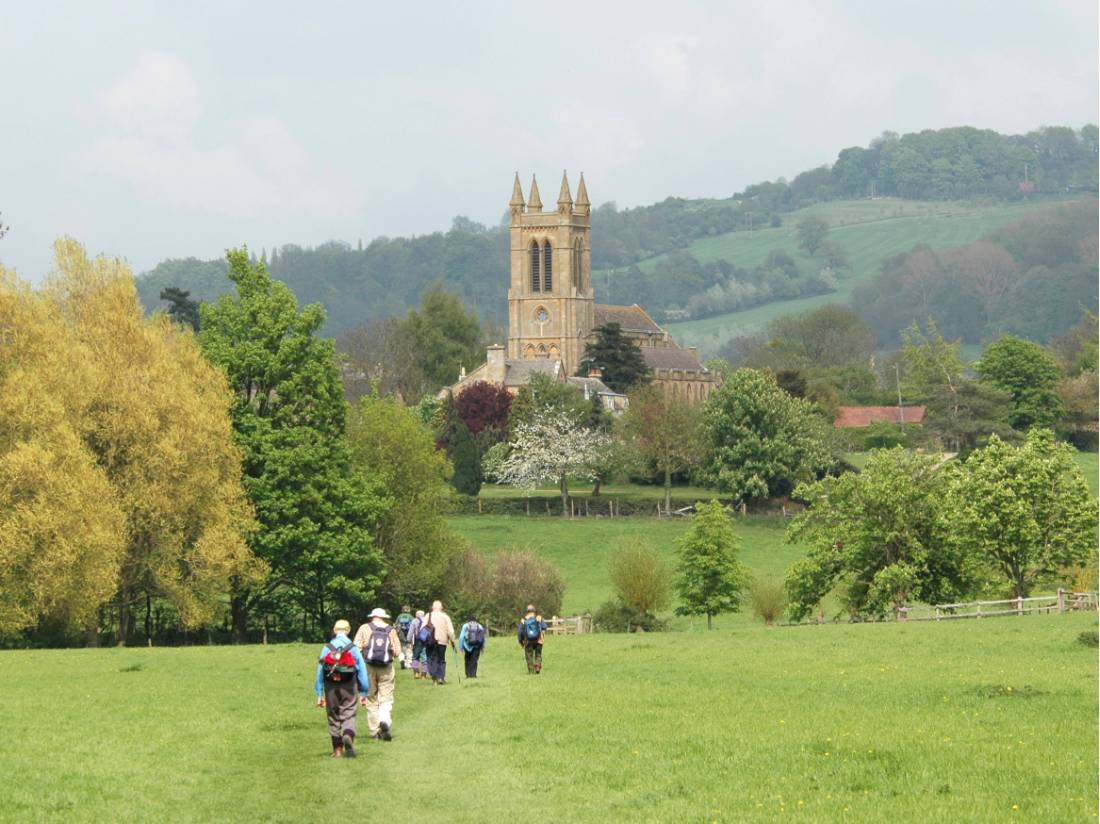 A group of walkers arrives in Broadway in the Cotswolds