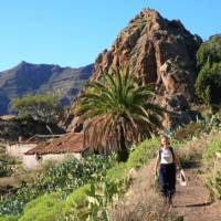 A hiker walking through Benchijigua in Gomera