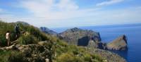 Walkers heading round the coast to Cala Codolar | John Millen