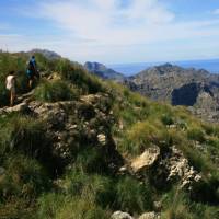 Walkers heading round the coast to Cala Codolar | John Millen