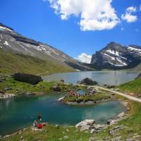 Hikers skirting glacial lakes on the way to Gemmi pass
