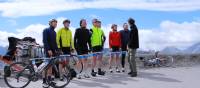 Happy cyclist faces after making it to the top of the Col