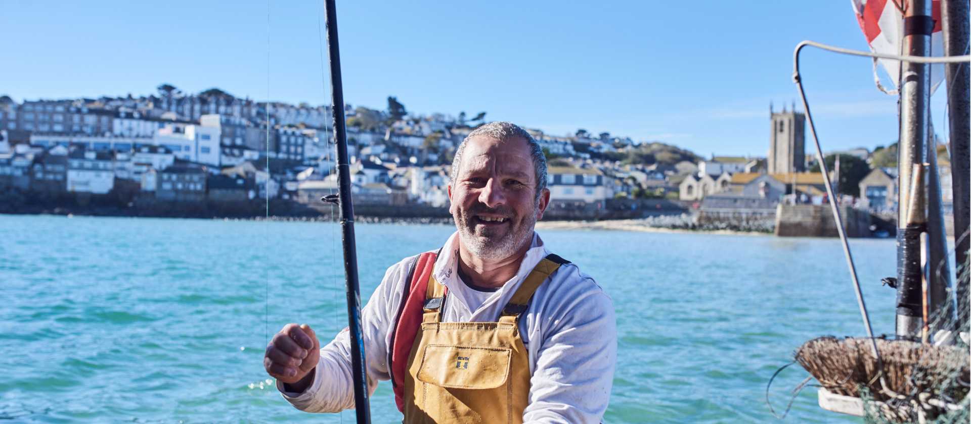 A happy Cornish fisherman in St Ives | Visit Britain
