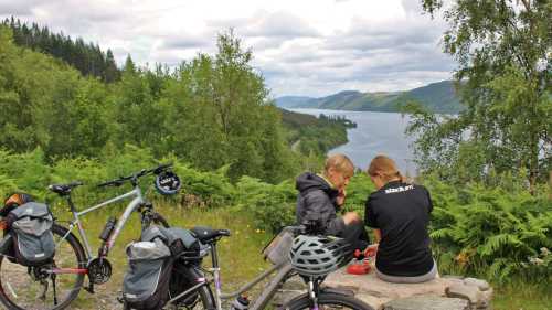 Cyclists overlooking Great Glen & Loch Ness in Scotland | Janette Crighton