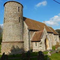 Norfolk Coast Path passes a flint round-tower church and churchyard | Peter Wells