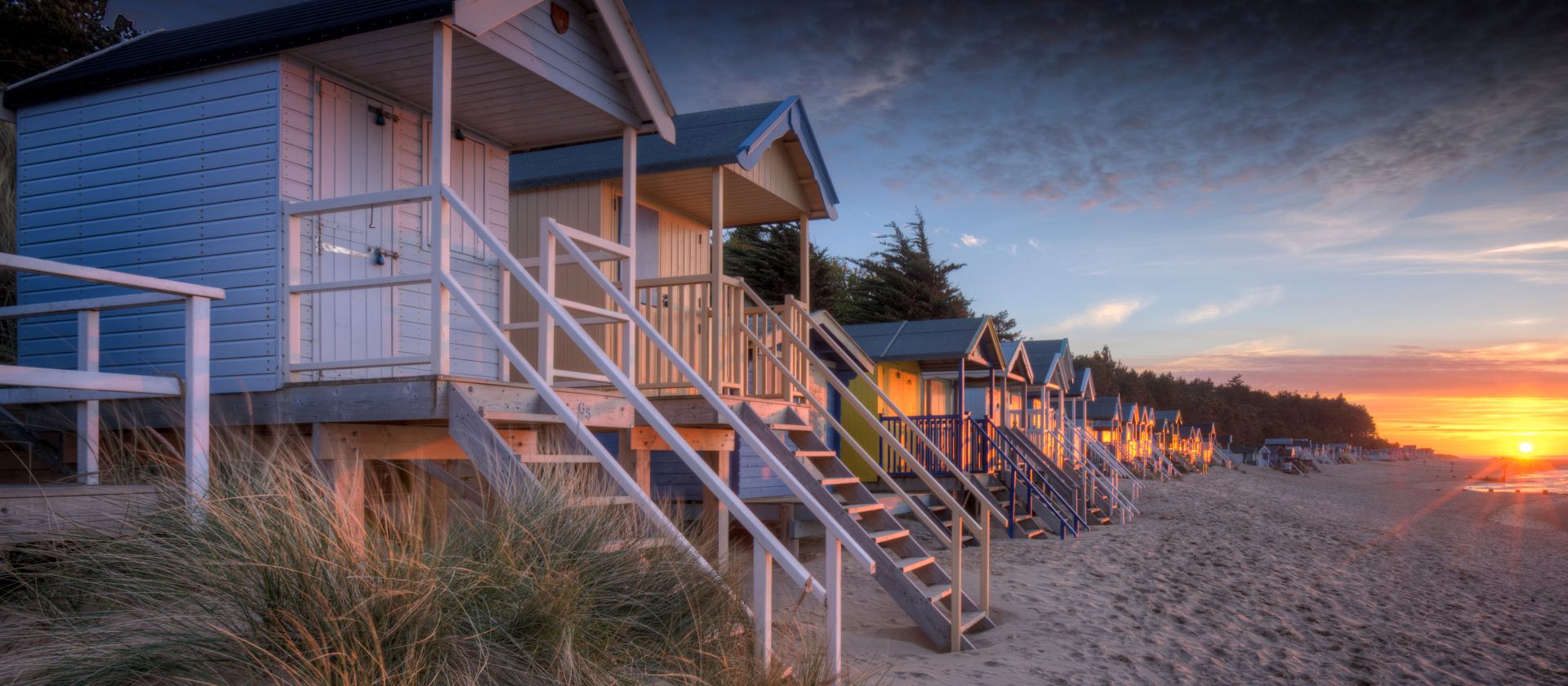 Row of beach huts at sunset at Wells-next-the-sea on the North Norfolk coast | Rod Edwards