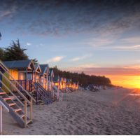 Row of beach huts at sunset at Wells-next-the-sea on the North Norfolk coast | Rod Edwards